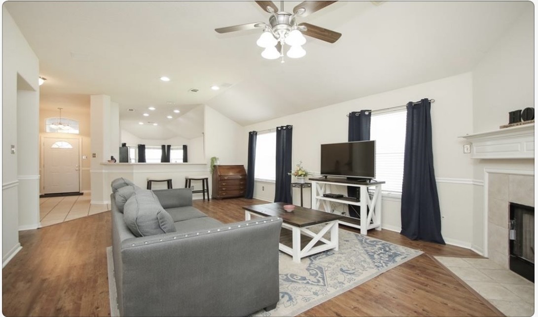 12006 Cyprus Field Houston, TX 77070 - Photo 6 of 7 a living room with furniture and a flat screen tv