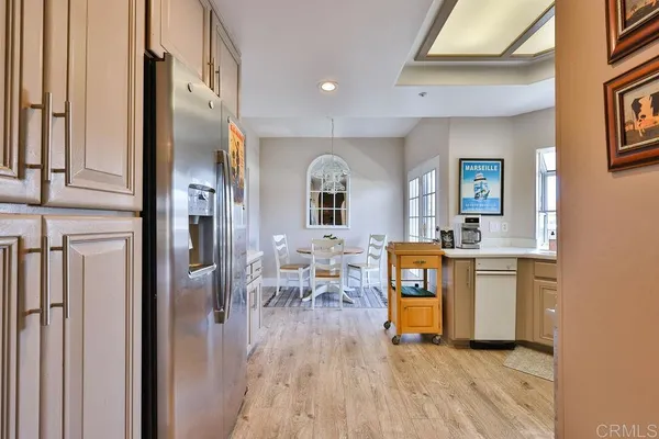 a kitchen with a stove sink and cabinets