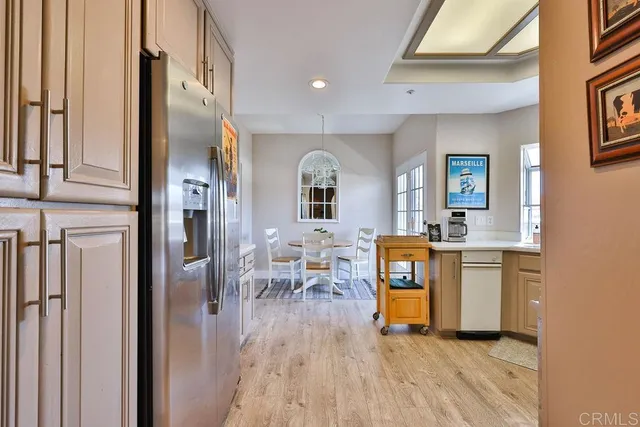 a kitchen with a stove sink and cabinets