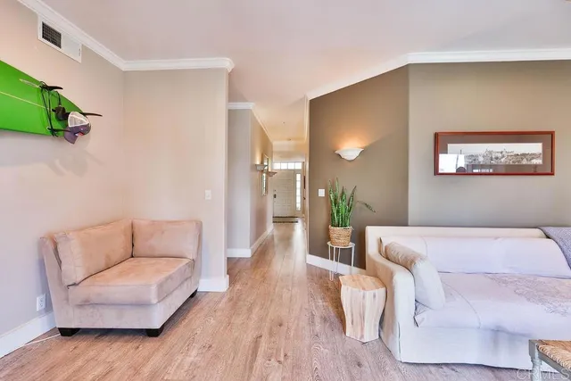 a bedroom with furniture and a flat screen tv