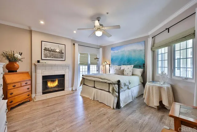 a spacious bedroom with a bed and a fireplace
