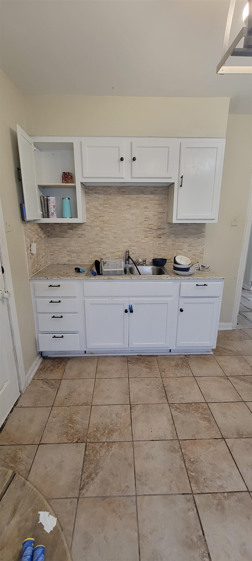 1480 Locust Street Memphis, TN 38108 - Photo 3 of 7 a kitchen with granite countertop a stove a sink and a granite counter tops