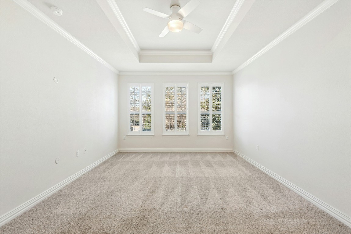310 Pipe Creek Lane Georgetown, TX 78633 - Photo 15 of 35 an empty room with windows and ceiling fan