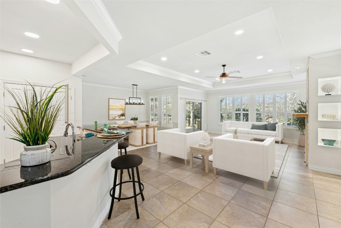 310 Pipe Creek Lane Georgetown, TX 78633 - Photo 4 of 35 a living room with furniture kitchen view and large windows