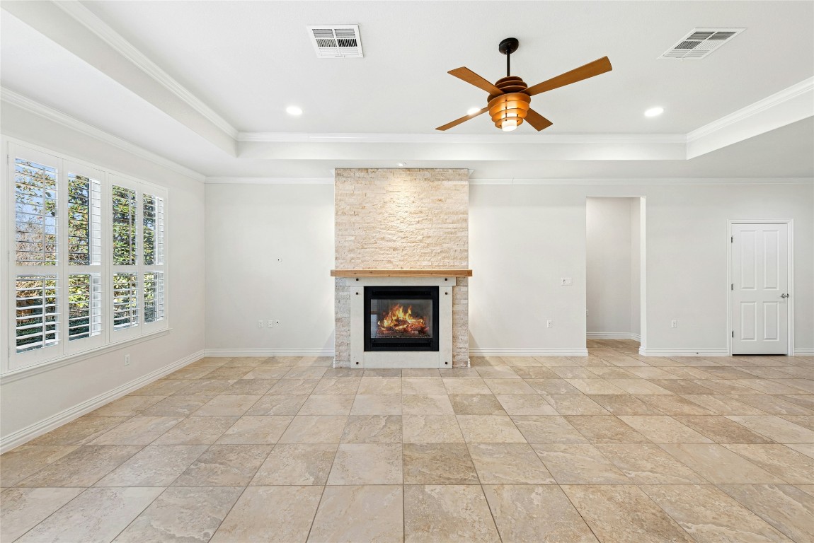 310 Pipe Creek Lane Georgetown, TX 78633 - Photo 5 of 35 a view of an empty room with a fireplace and a window