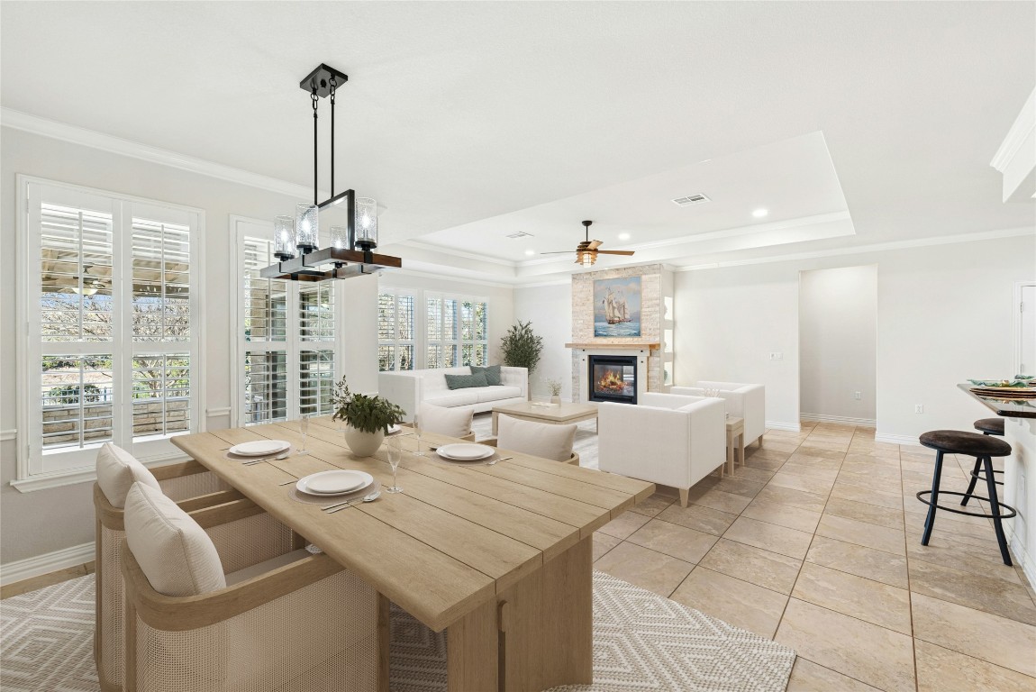 310 Pipe Creek Lane Georgetown, TX 78633 - Photo 8 of 35 a view of a dining room and livingroom with furniture wooden floor a chandelier