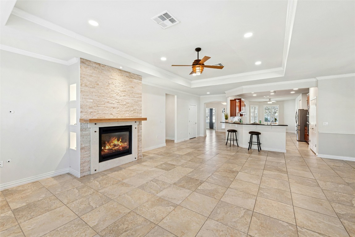 310 Pipe Creek Lane Georgetown, TX 78633 - Photo 9 of 35 a living room with furniture and a fireplace