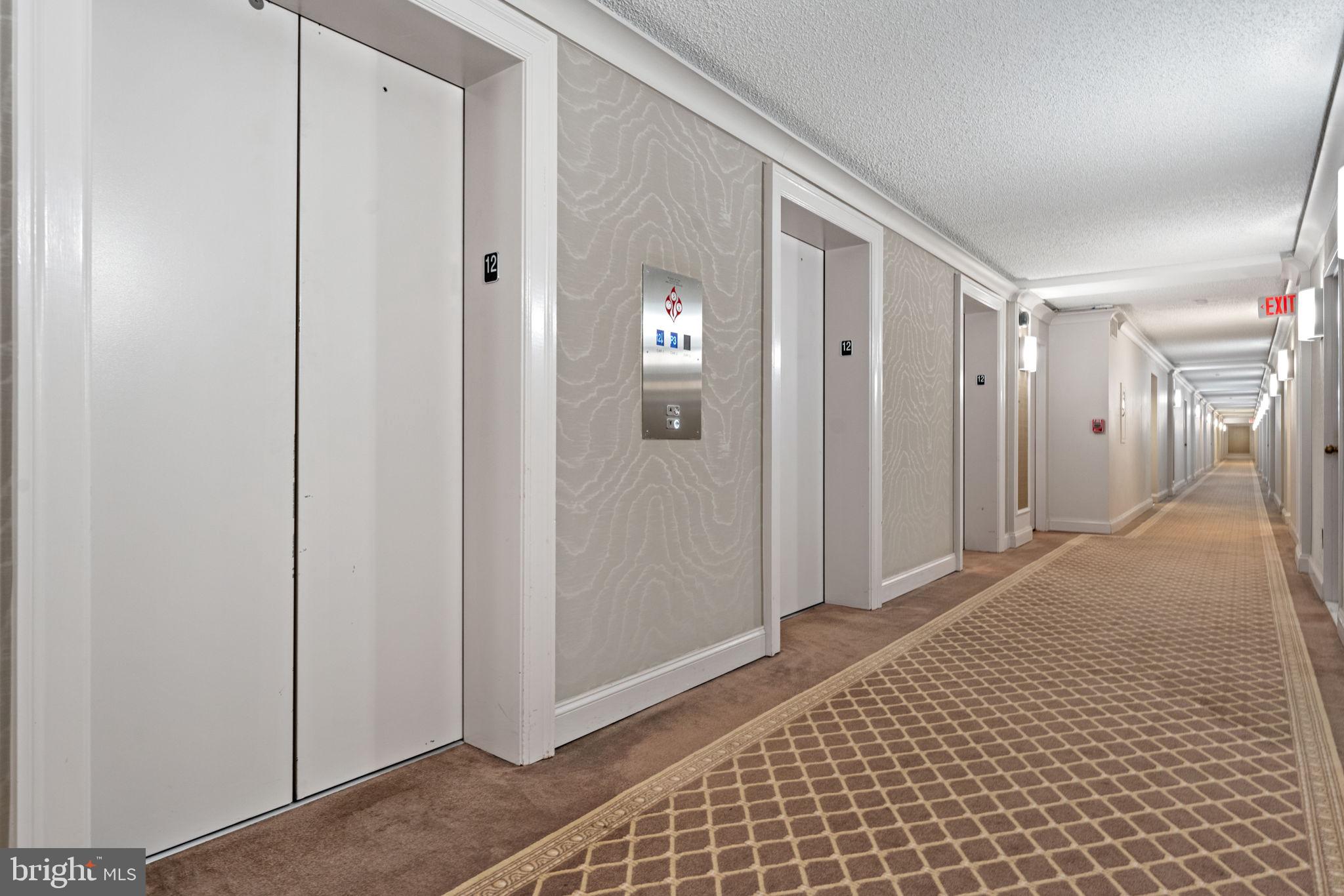 1800 Old Meadow Road, Unit 1218 McLean, VA 22102 - Photo 12 of 55 a view of a hallway with wooden floor and closet area