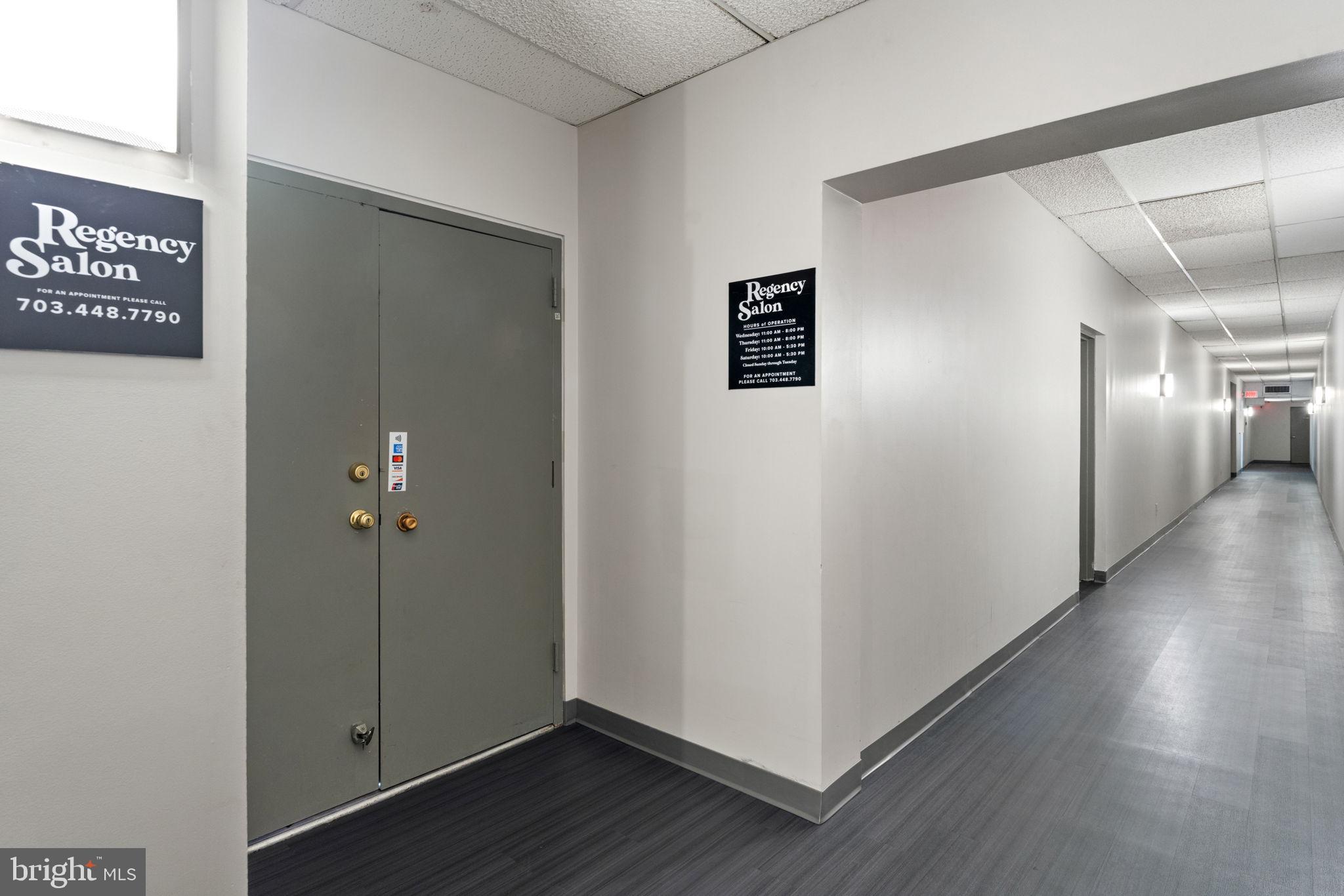 1800 Old Meadow Road, Unit 1218 McLean, VA 22102 - Photo 13 of 55 a view of a hallway with wooden floor