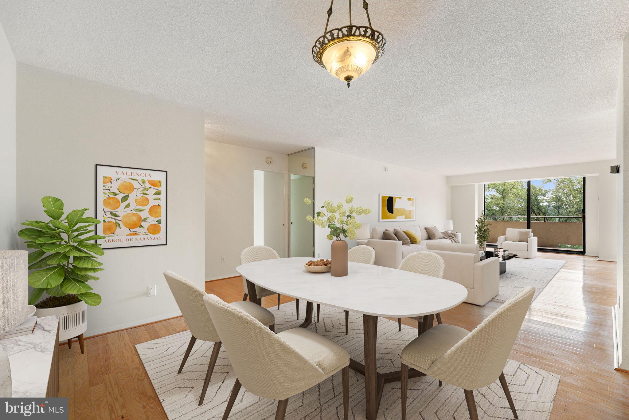 1800 Old Meadow Road, Unit 1218 McLean, VA 22102 - Photo 17 of 55 a view of a dining room with furniture and wooden floor