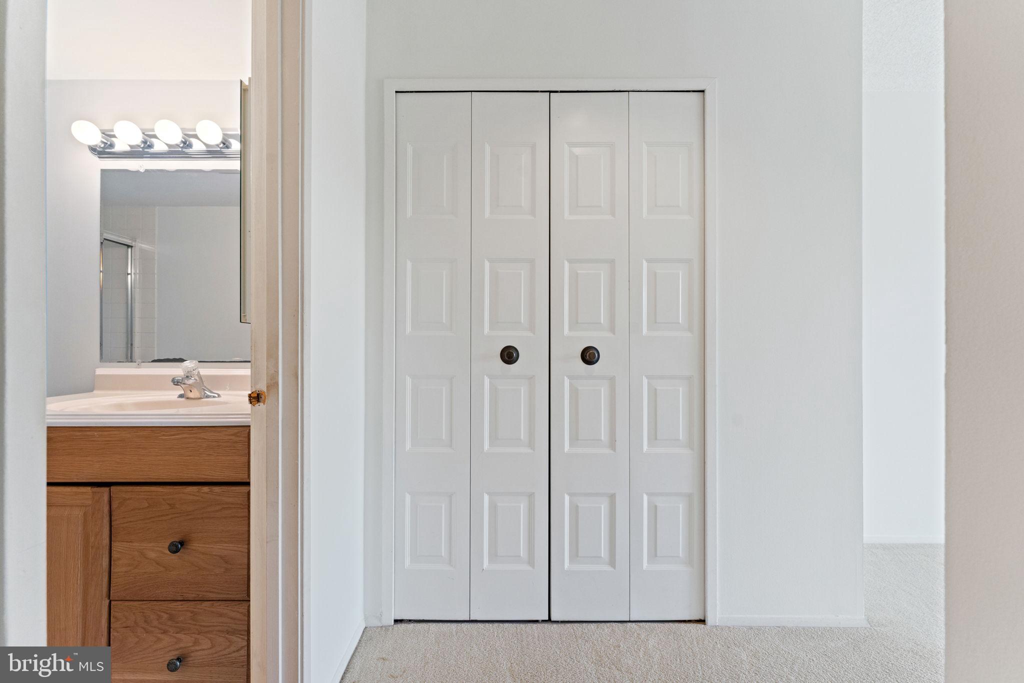 1800 Old Meadow Road, Unit 1218 McLean, VA 22102 - Photo 35 of 55 a bathroom with a granite countertop sink and mirror