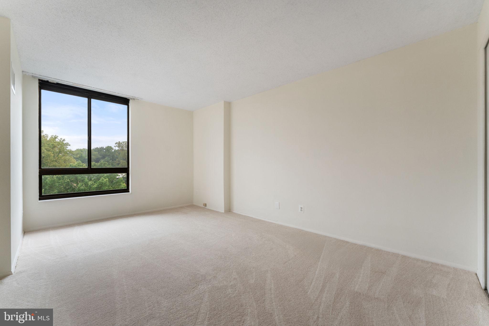 1800 Old Meadow Road, Unit 1218 McLean, VA 22102 - Photo 37 of 55 a view of a big room with windows and closet
