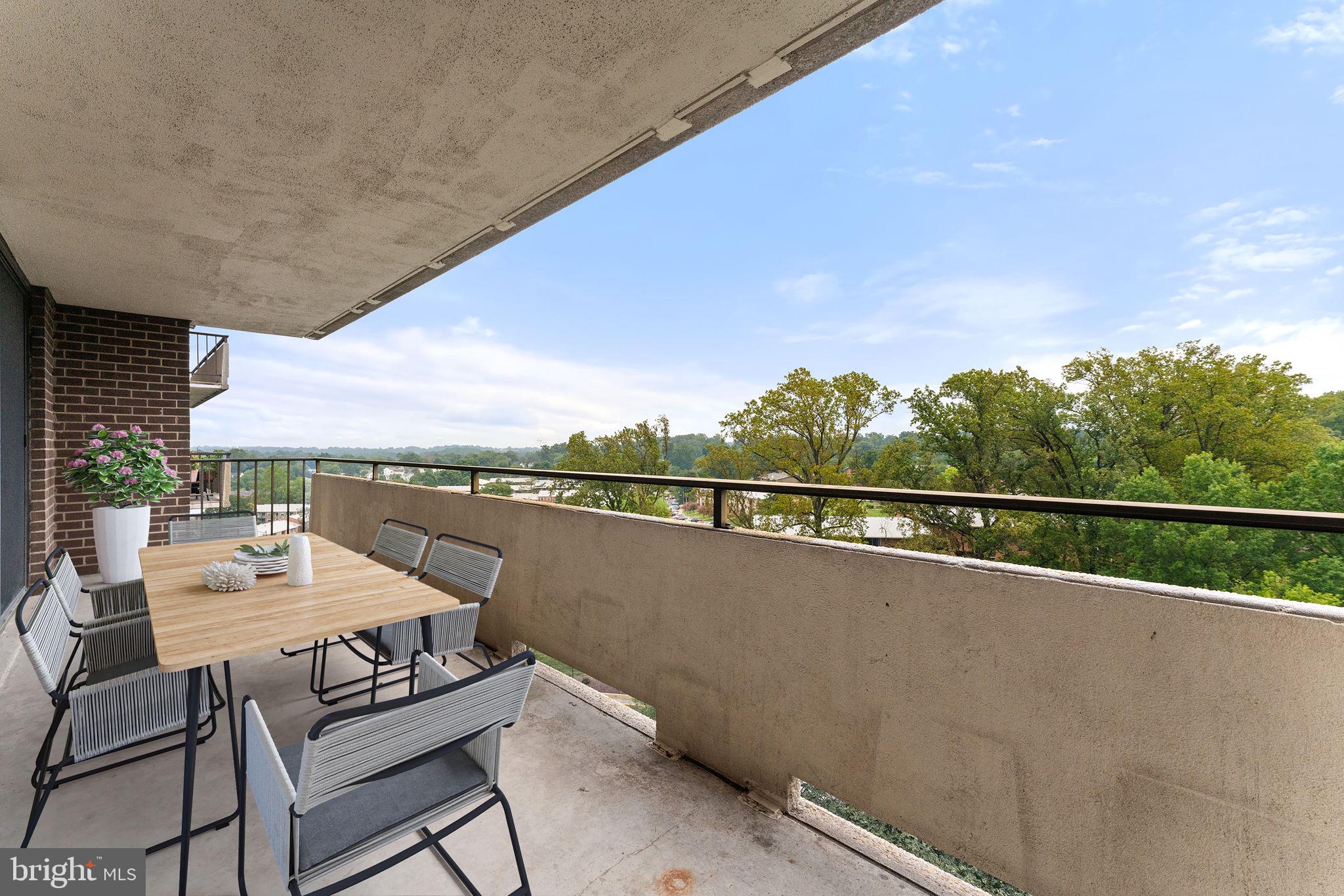 1800 Old Meadow Road, Unit 1218 McLean, VA 22102 - Photo 42 of 55 a balcony with an outdoor seating