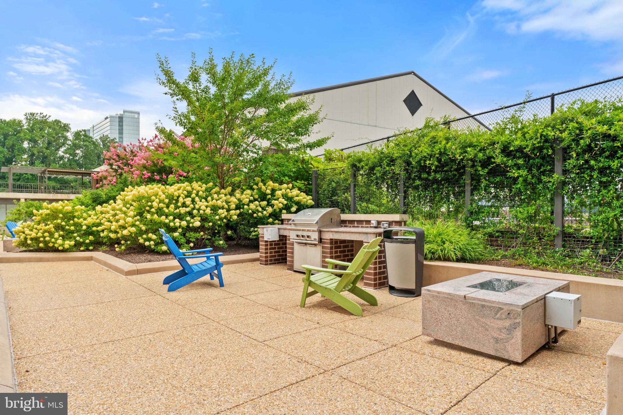 1800 Old Meadow Road, Unit 1218 McLean, VA 22102 - Photo 45 of 55 a view of a patio with table and chairs and potted plants
