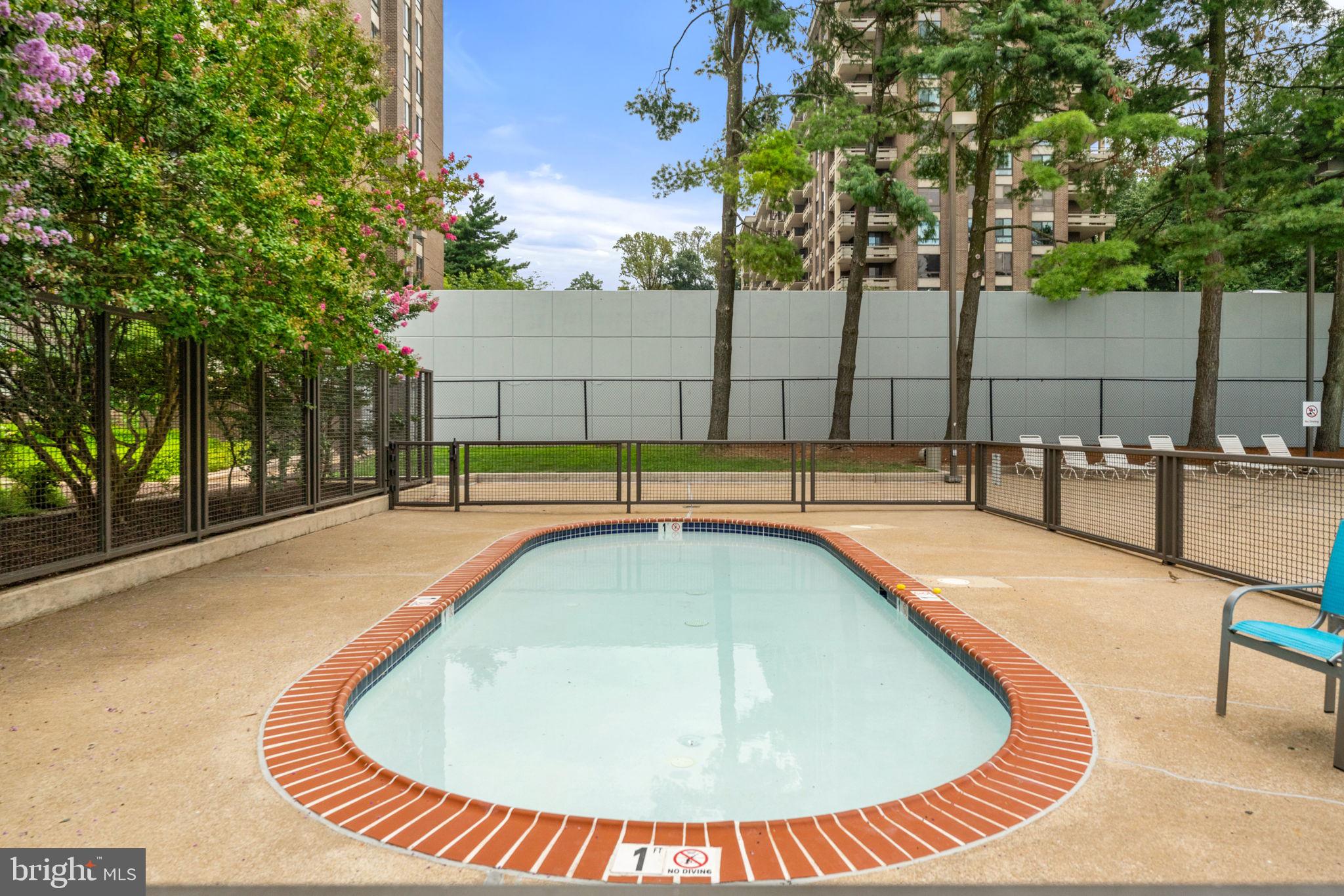 1800 Old Meadow Road, Unit 1218 McLean, VA 22102 - Photo 49 of 55 a view of a swimming pool with a patio
