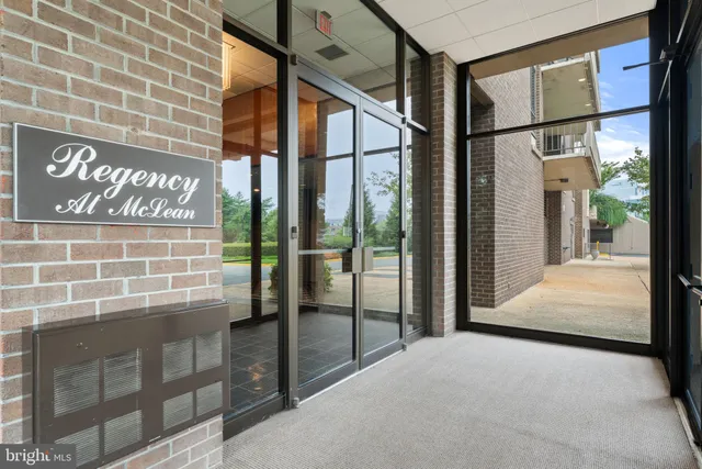 a view of a living room and hallway with wooden floor