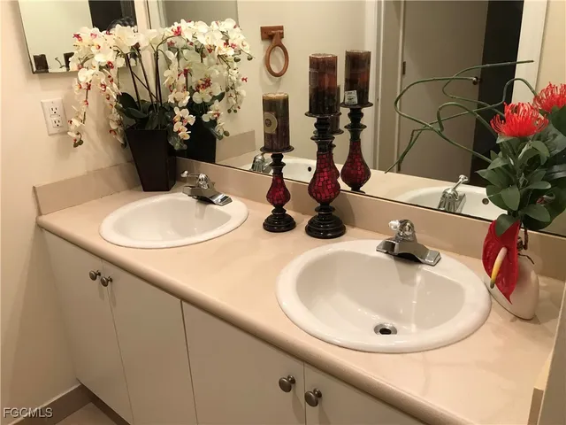 a bathroom with a sink and mirror
