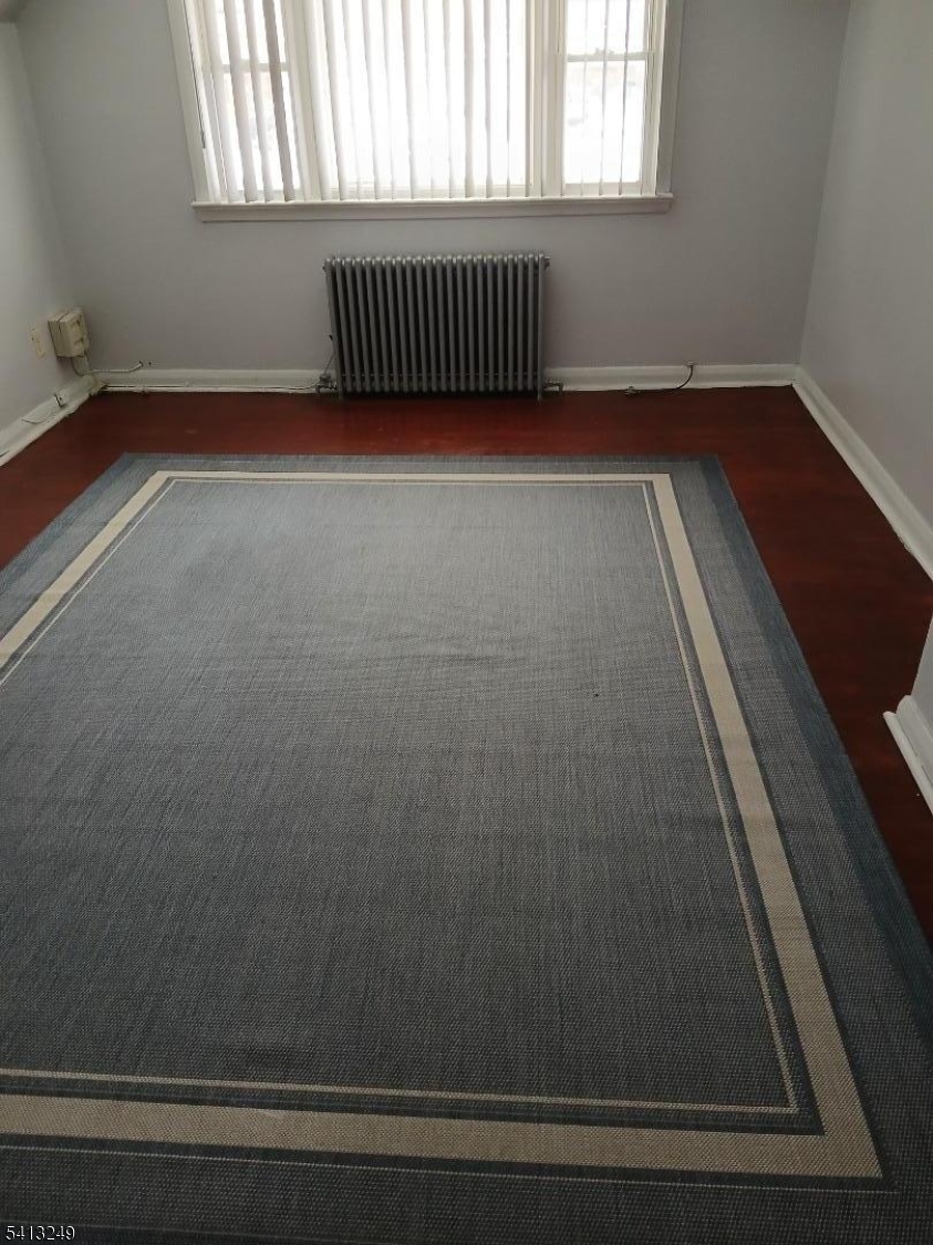 97 Main Avenue, Unit 2 Passaic, NJ 07055 - Photo 4 of 10 a view of entryway with wooden floor