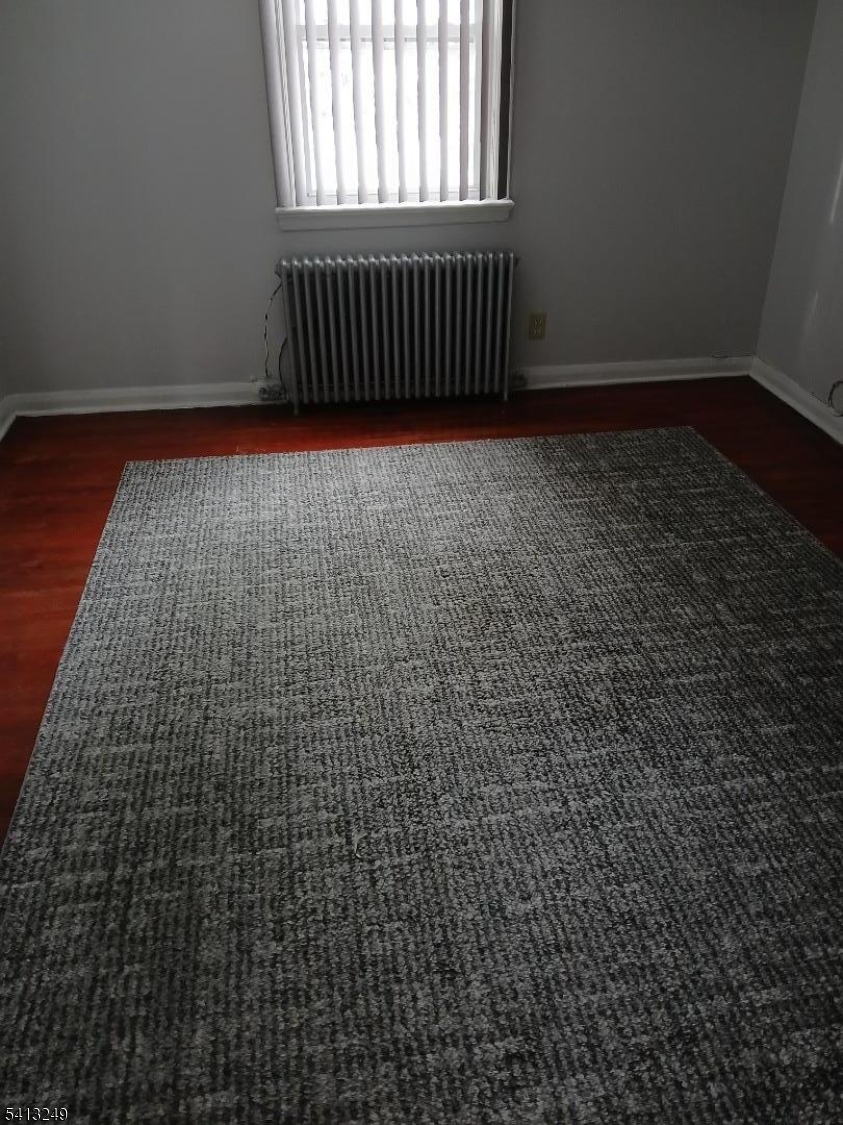 97 Main Avenue, Unit 2 Passaic, NJ 07055 - Photo 5 of 10 a view of a black gate