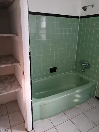 a bathroom with a shower and a bathtub