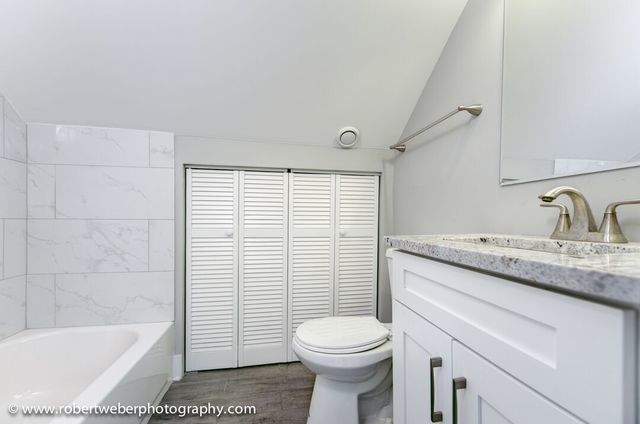 1363 West Walton Street Chicago, IL 60642 - Photo 11 of 13 a bathroom with a sink toilet and shower