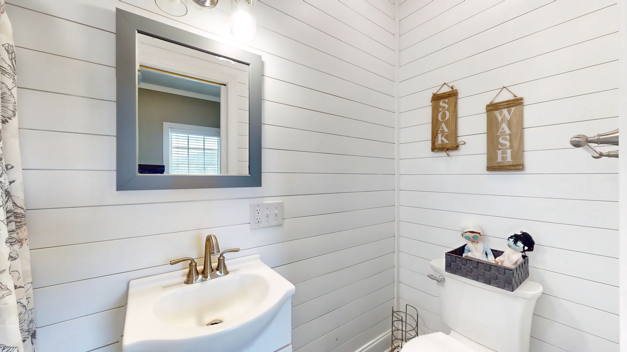 6697 Greenvale Road Watertown, TN 37184 - Photo 18 of 36 a bathroom with a toilet sink and mirror