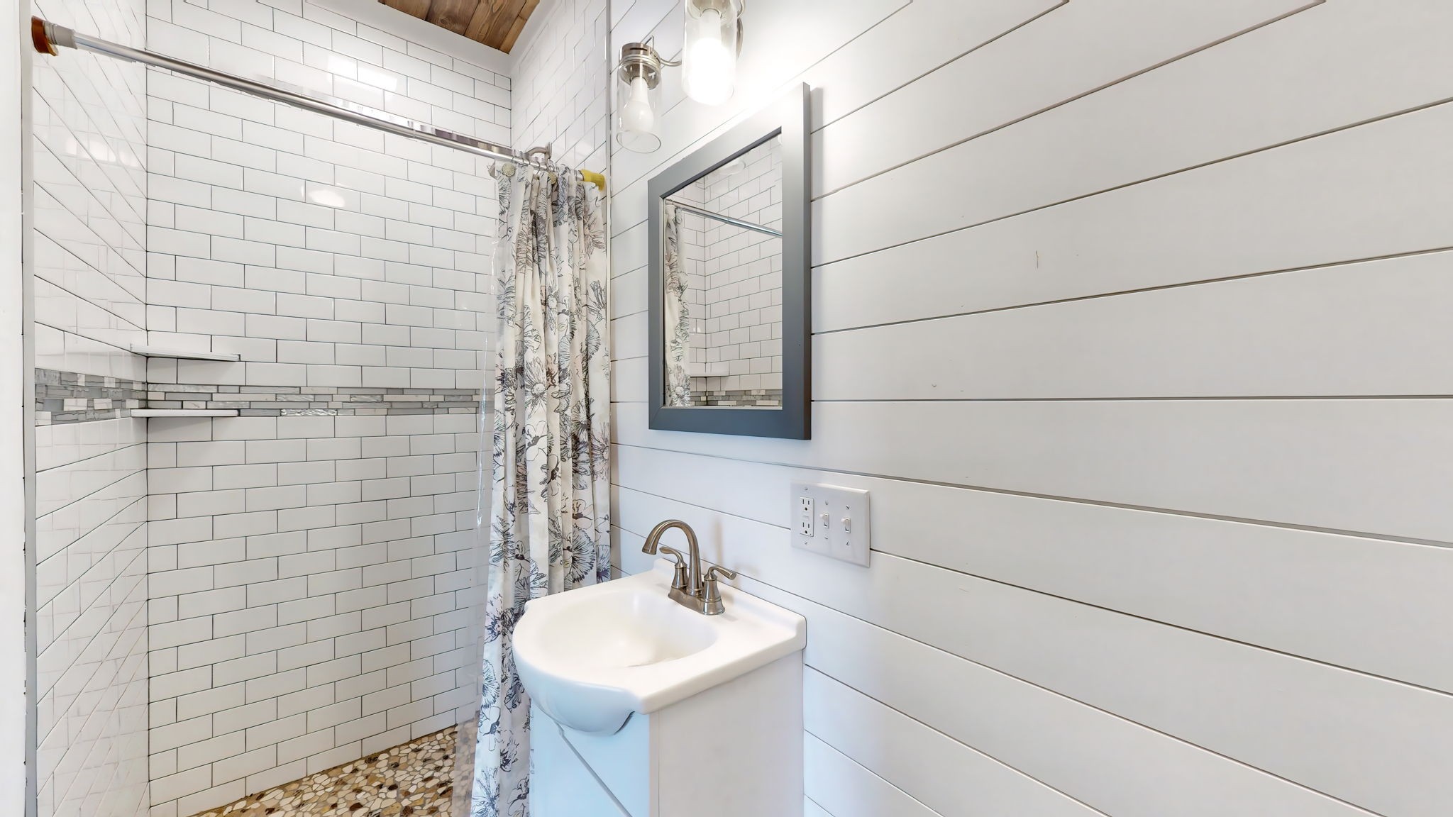 6697 Greenvale Road Watertown, TN 37184 - Photo 19 of 36 a bathroom with a sink shower and a mirror