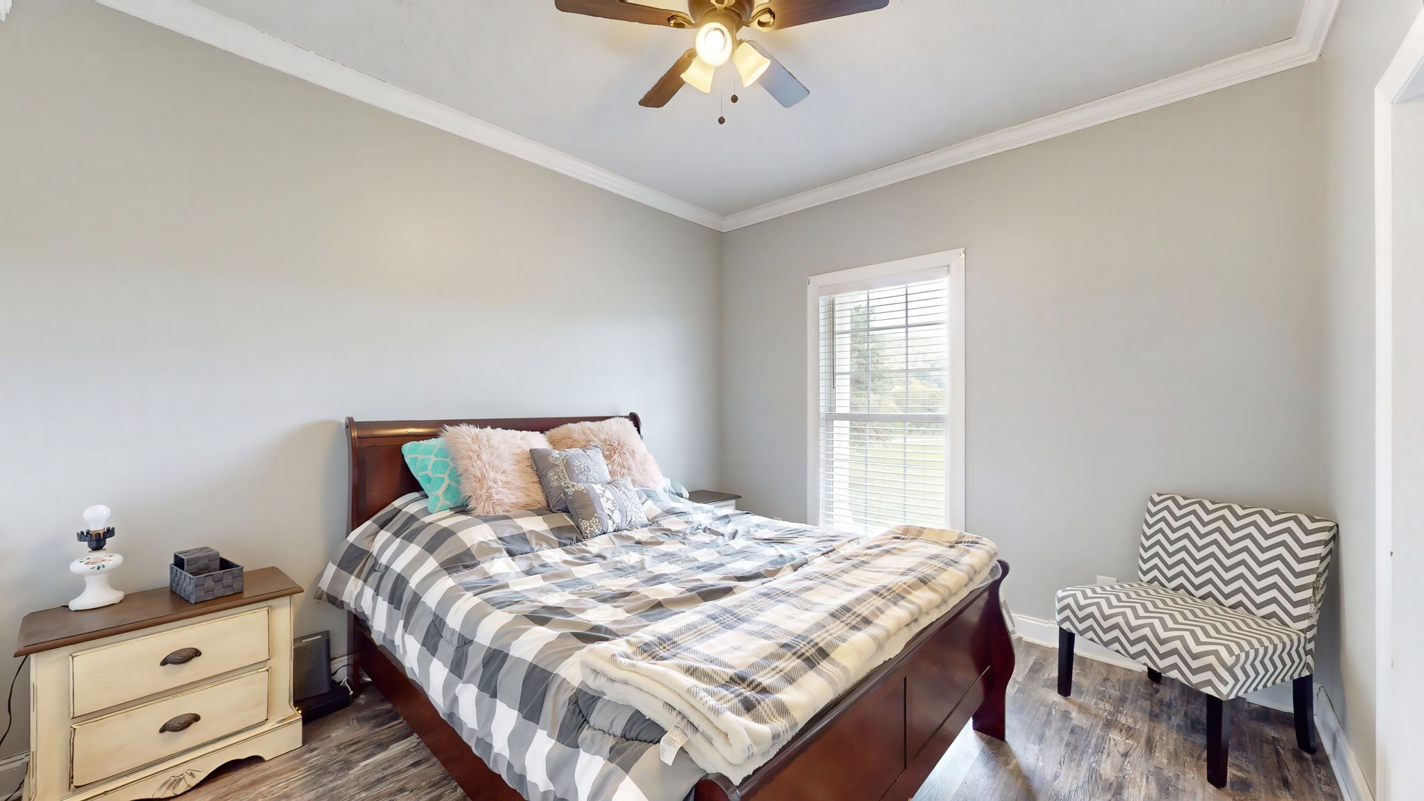 6697 Greenvale Road Watertown, TN 37184 - Photo 21 of 36 a bedroom with a bed and a chandelier