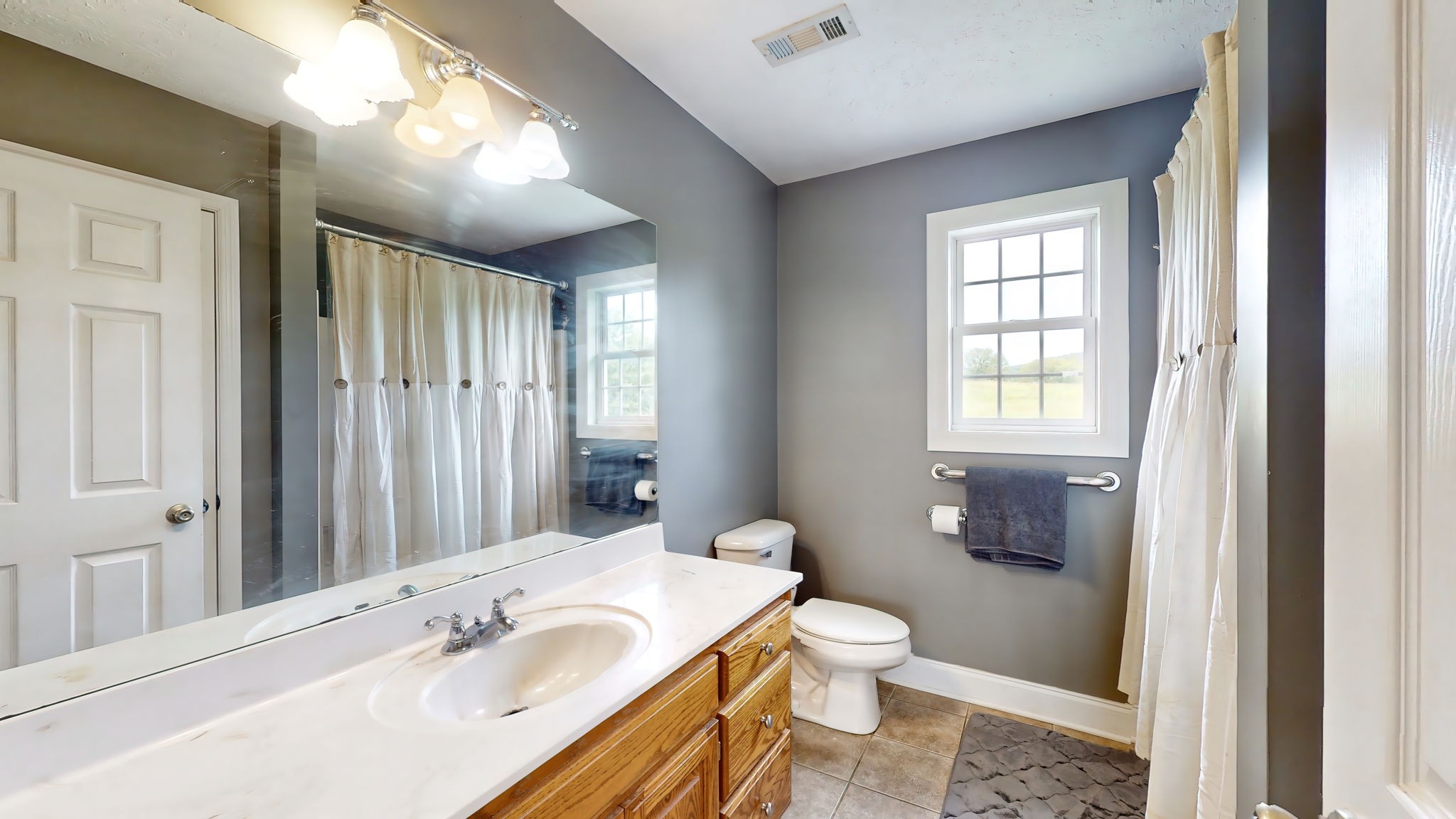 6697 Greenvale Road Watertown, TN 37184 - Photo 23 of 36 a bathroom with a sink toilet and shower