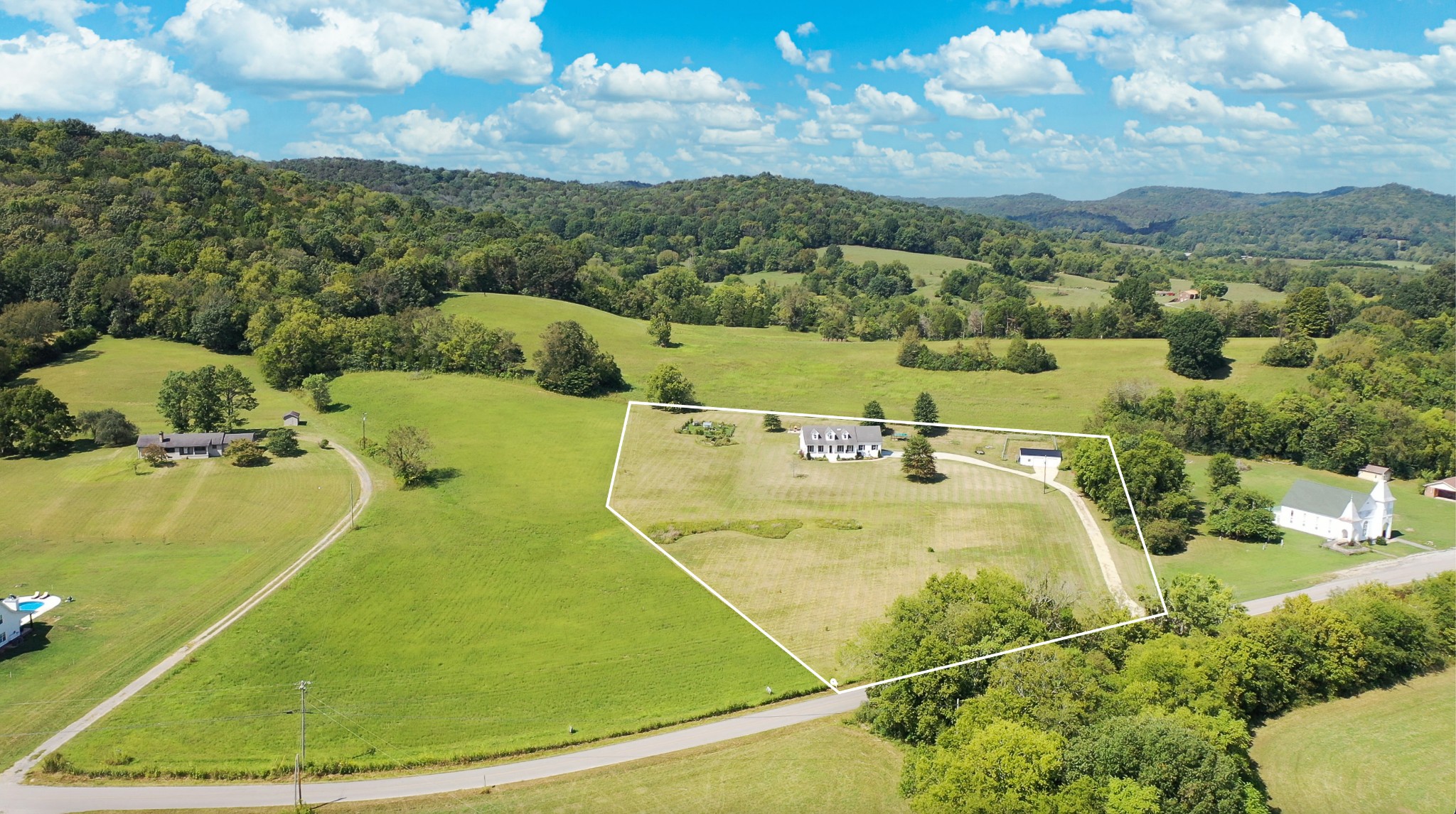 6697 Greenvale Road Watertown, TN 37184 - Photo 27 of 36 a view of a swimming pool with a lake view