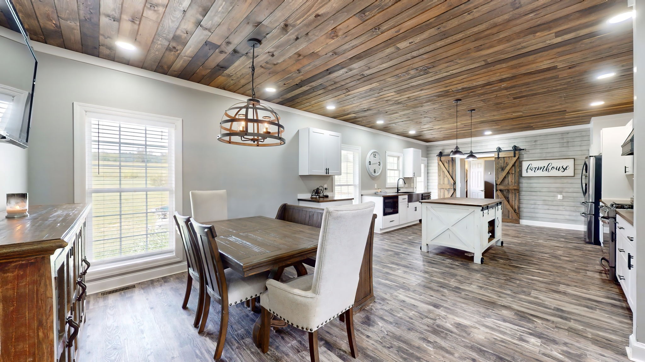 6697 Greenvale Road Watertown, TN 37184 - Photo 3 of 36 a view of a dining room with furniture window and wooden floor