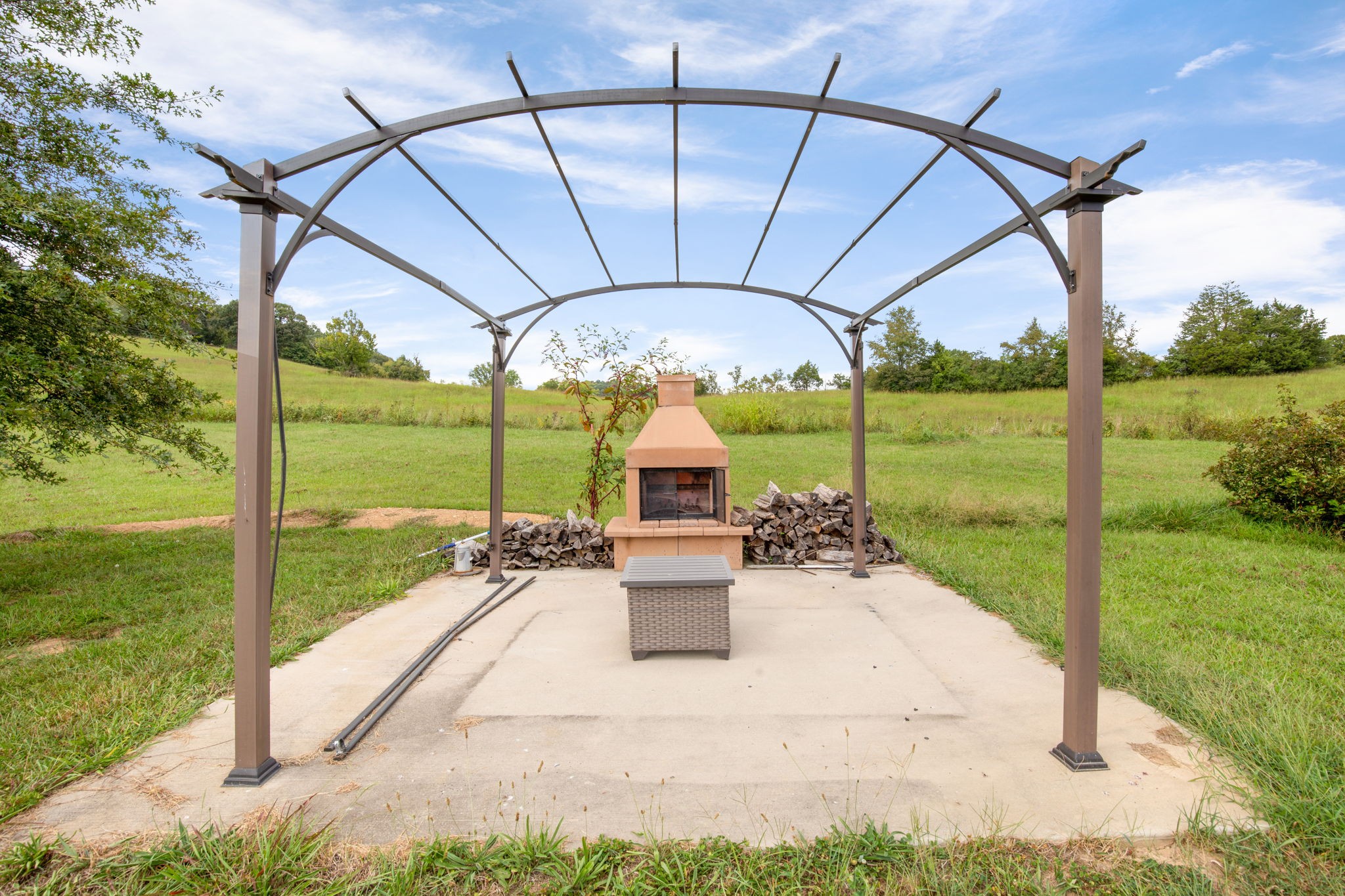 6697 Greenvale Road Watertown, TN 37184 - Photo 31 of 36 a patio with table and chairs and a yard