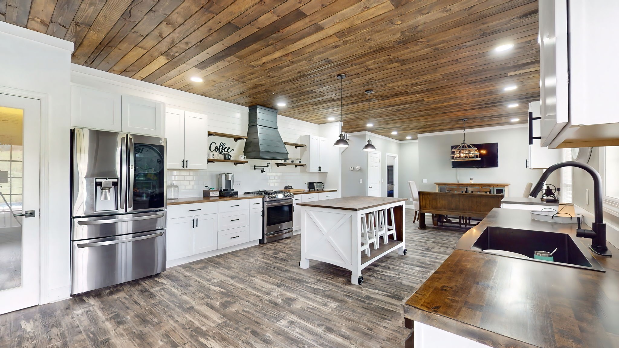 6697 Greenvale Road Watertown, TN 37184 - Photo 5 of 36 a kitchen with stainless steel appliances granite countertop a sink refrigerator and cabinets