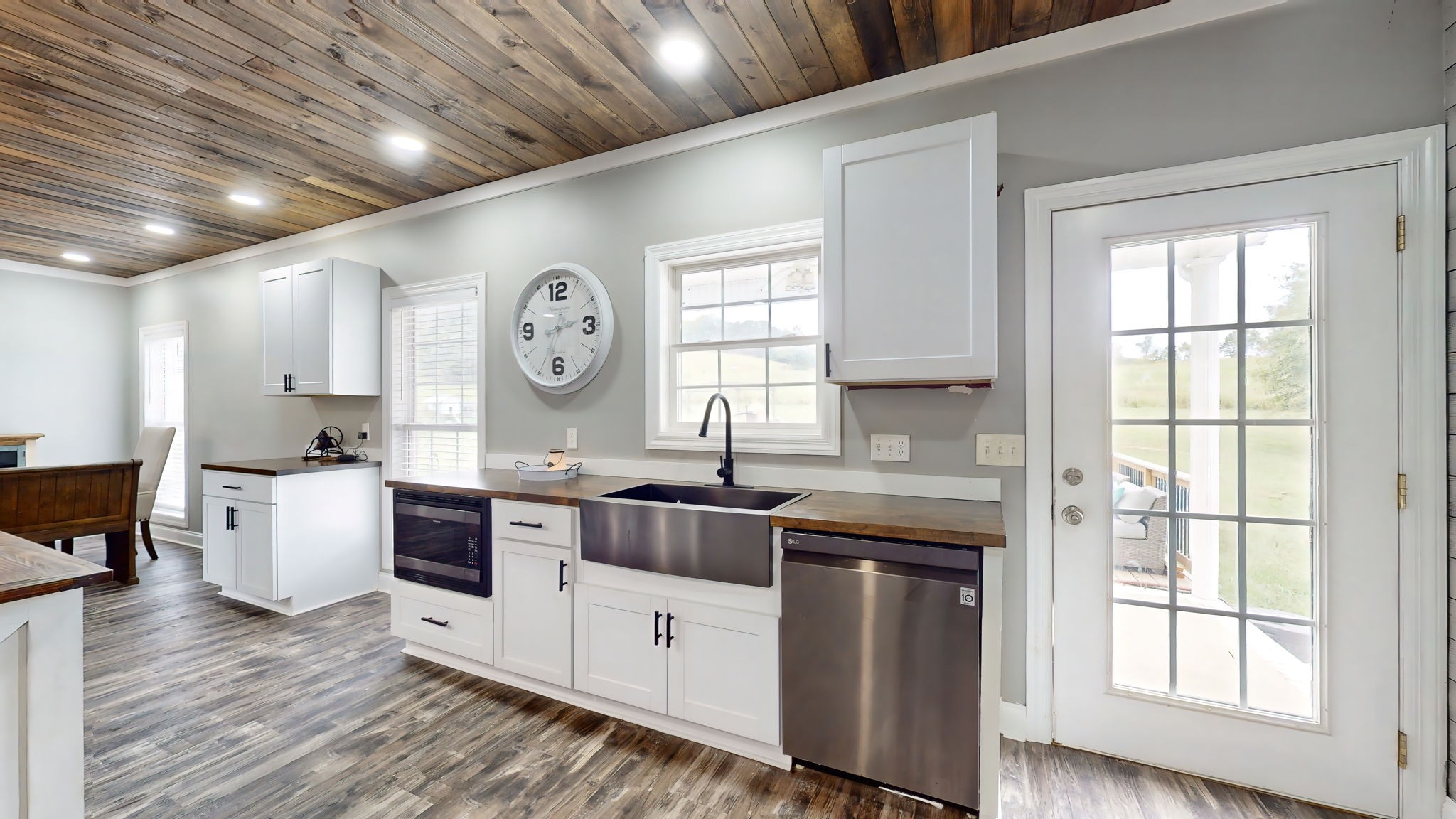 6697 Greenvale Road Watertown, TN 37184 - Photo 7 of 36 a large kitchen with cabinets wooden floor and a stainless steel appliances
