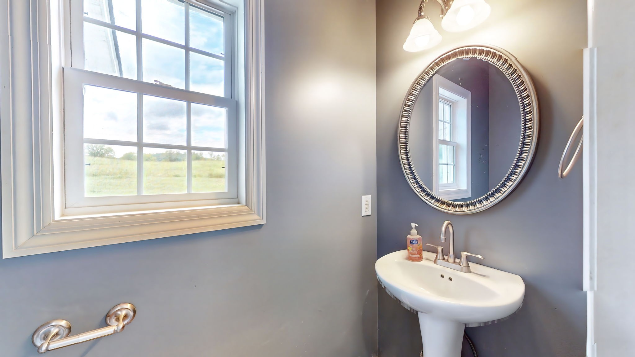 6697 Greenvale Road Watertown, TN 37184 - Photo 9 of 36 a bathroom with a sink and a mirror