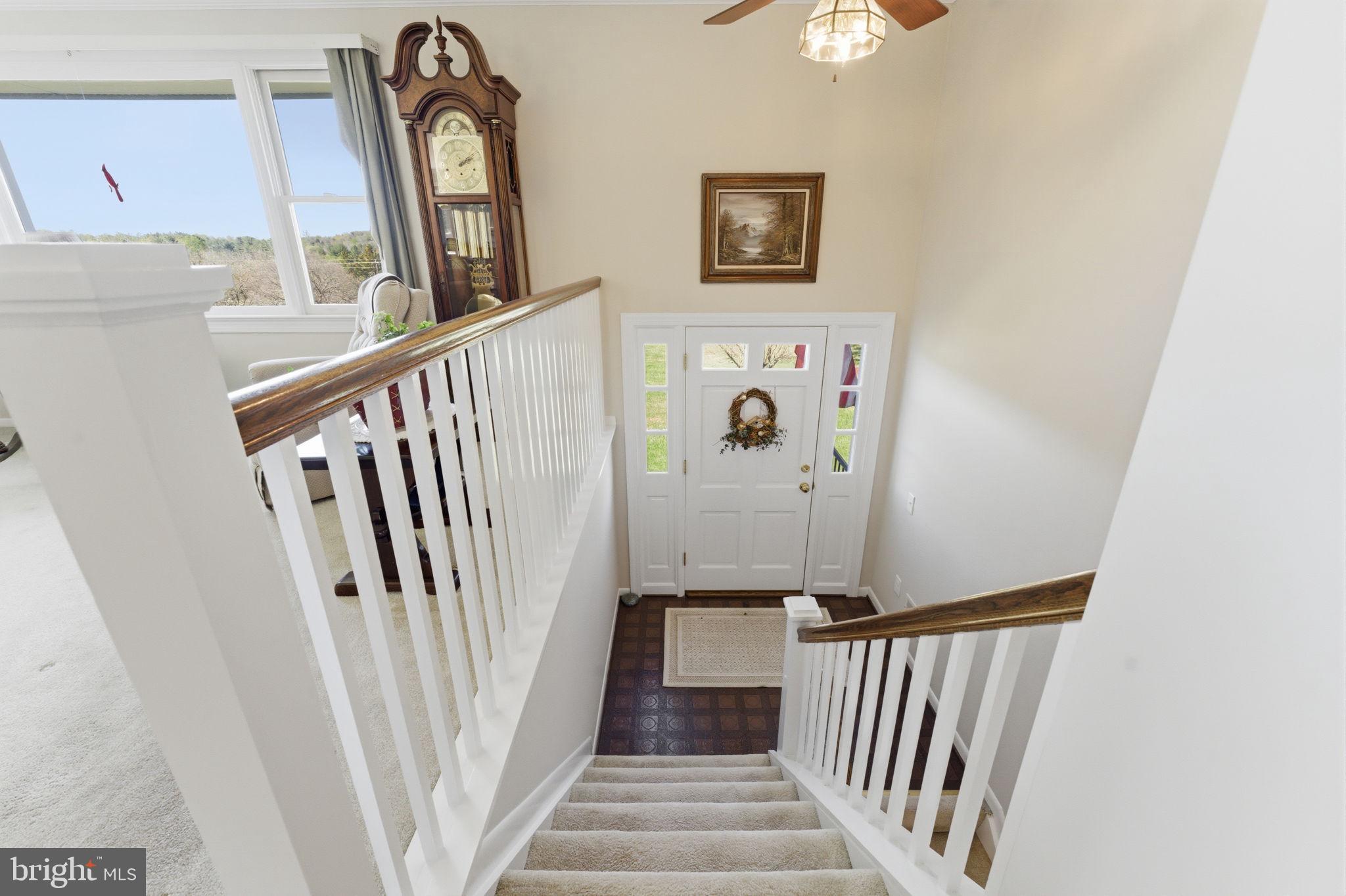 6163 Georgetown Road Broad Run, VA 20137 - Photo 12 of 94 a view of a hallway with entryway wooden floor and front door