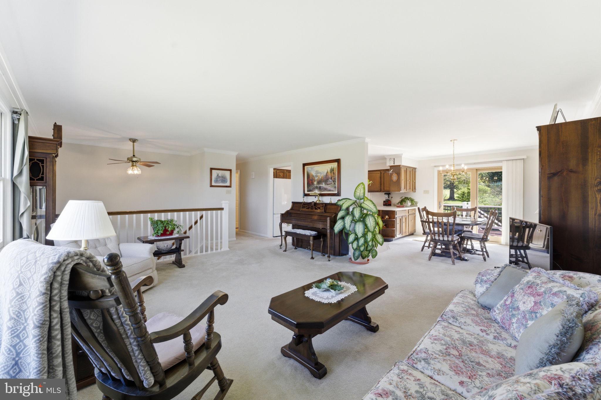 6163 Georgetown Road Broad Run, VA 20137 - Photo 15 of 94 a living room with furniture and a dining table with wooden floor