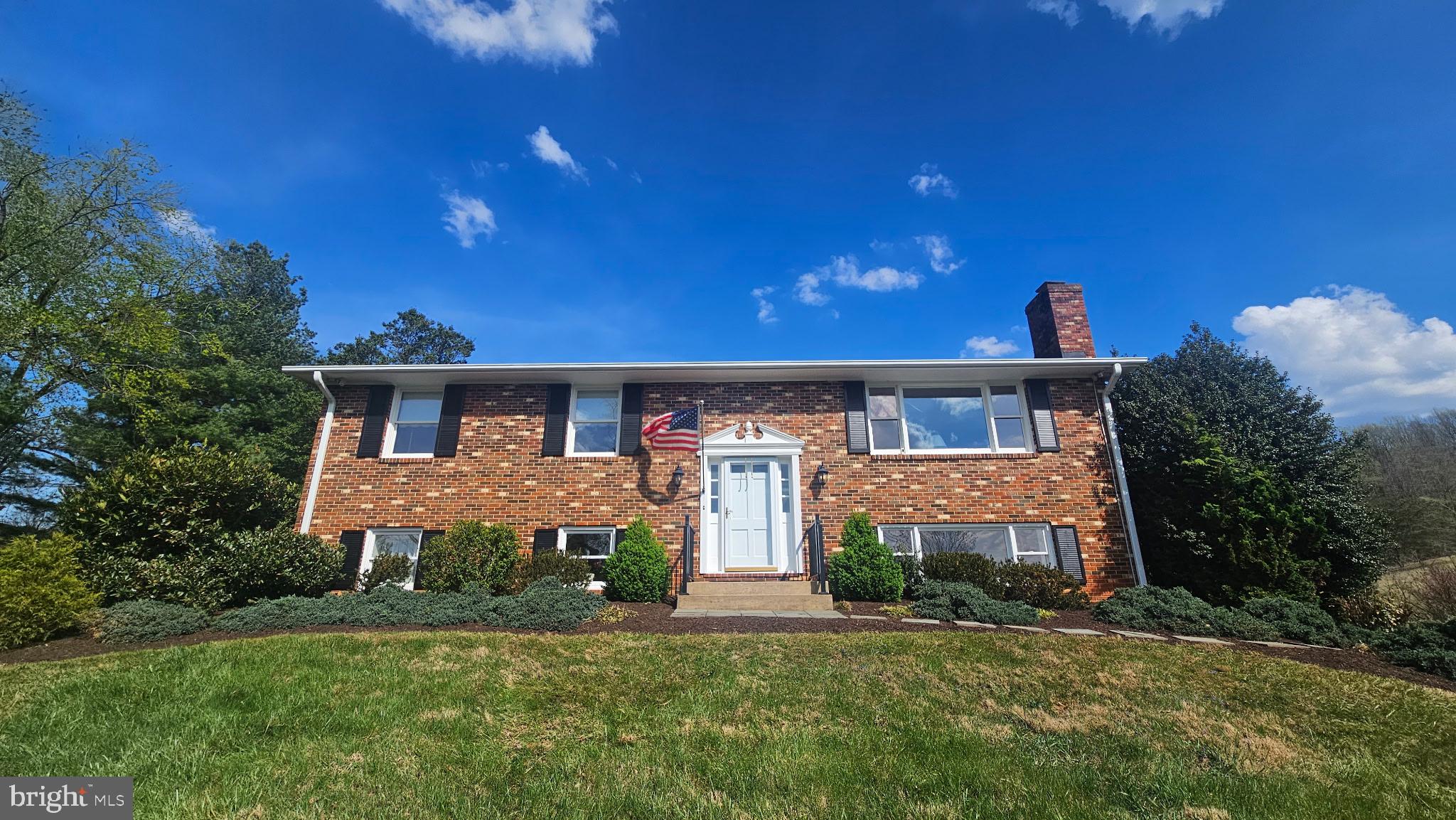 6163 Georgetown Road Broad Run, VA 20137 - Photo 2 of 94 a front view of a house with a yard