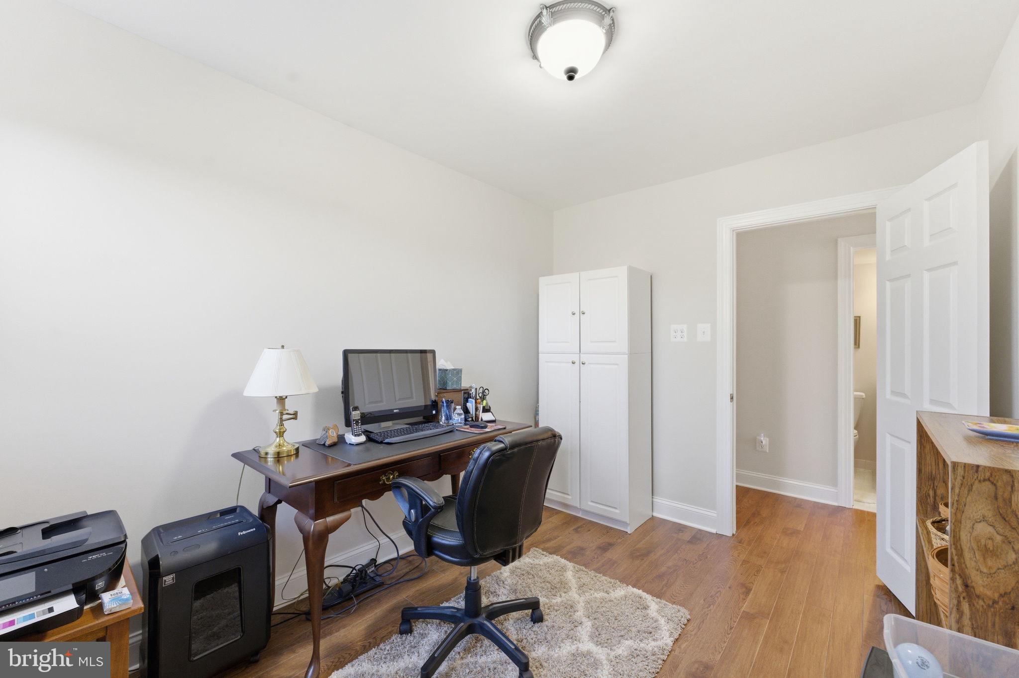 6163 Georgetown Road Broad Run, VA 20137 - Photo 45 of 94 a view of a workspace with furniture and wooden floor