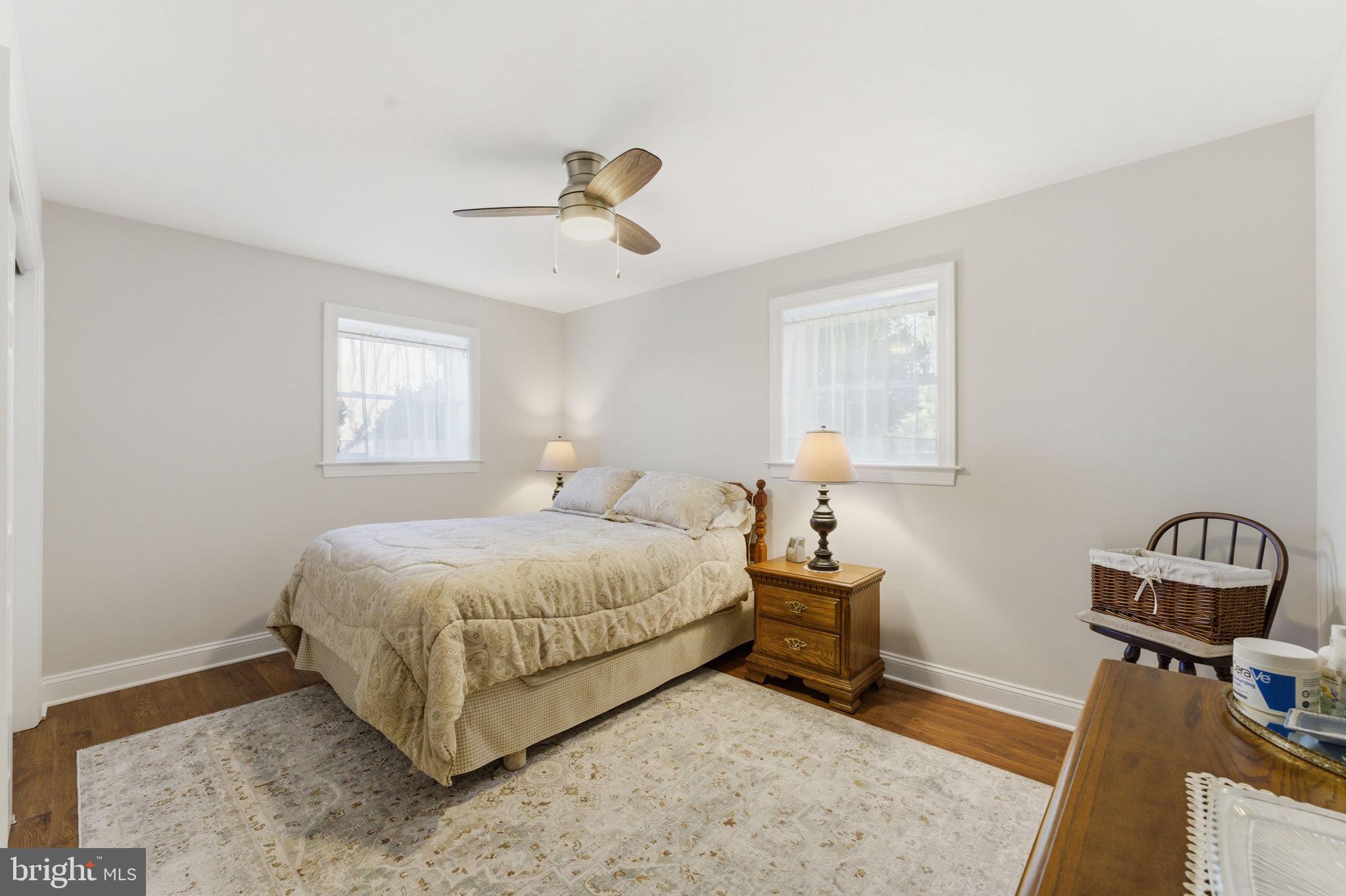 6163 Georgetown Road Broad Run, VA 20137 - Photo 46 of 94 a bedroom with a bed a table and painting on the wall