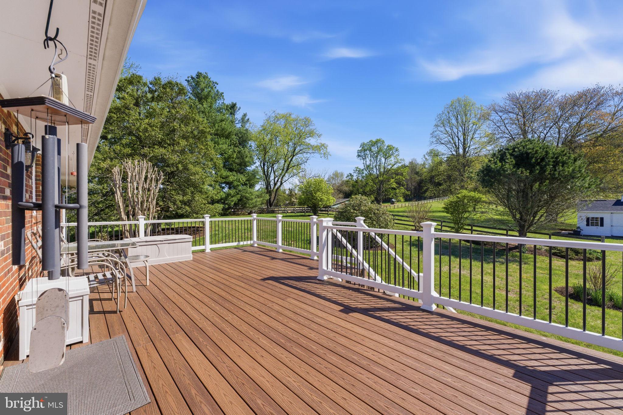 6163 Georgetown Road Broad Run, VA 20137 - Photo 5 of 94 a view of a balcony with wooden floor and fence