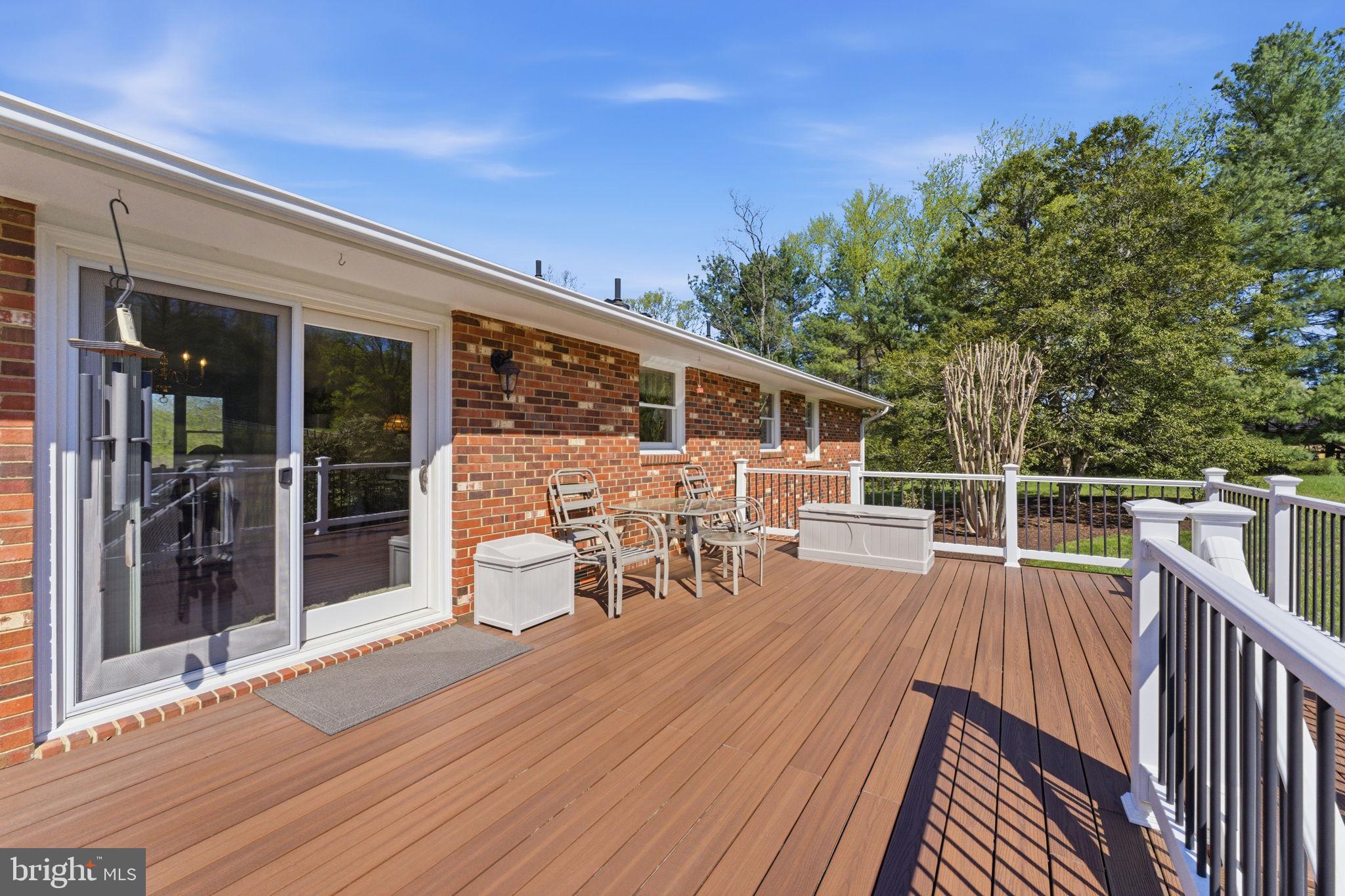6163 Georgetown Road Broad Run, VA 20137 - Photo 54 of 94 a view of a balcony with chairs and wooden floor