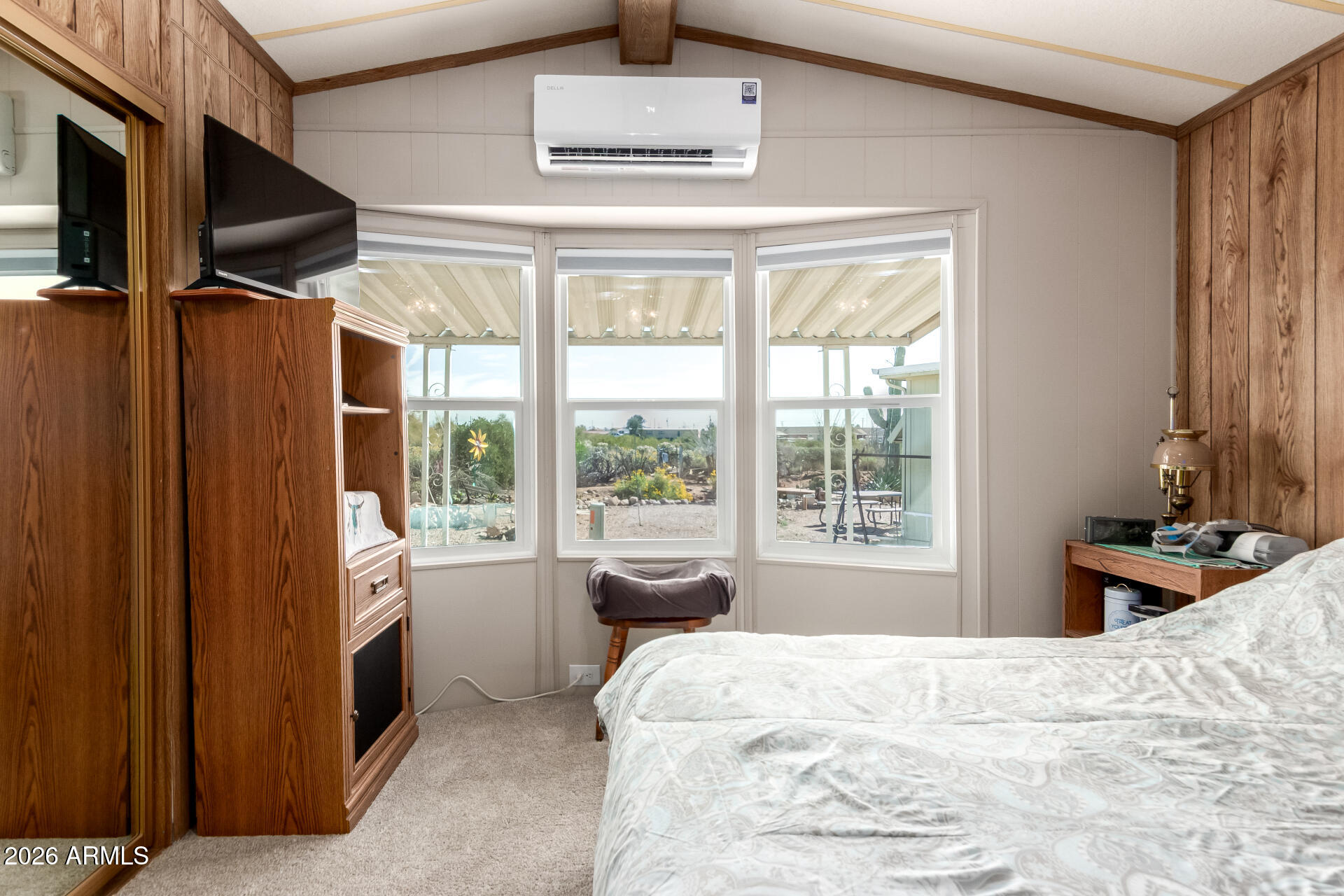 269 North Winchester Road, Unit 66 Apache Junction, AZ 85119 - Photo 16 of 28 a bedroom with a bed dresser and a window
