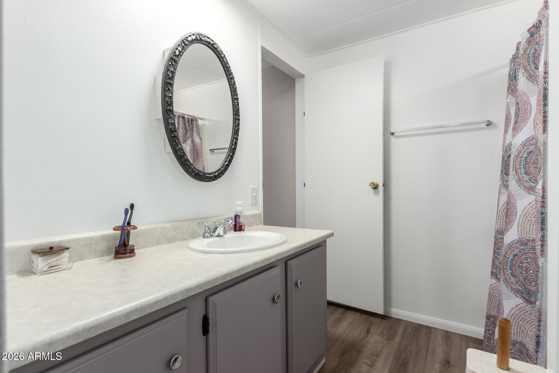 269 North Winchester Road, Unit 66 Apache Junction, AZ 85119 - Photo 18 of 28 a bathroom with a sink and a mirror