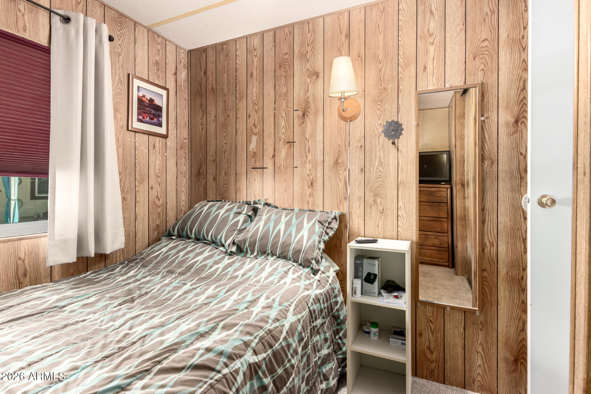 269 North Winchester Road, Unit 66 Apache Junction, AZ 85119 - Photo 20 of 28 a bedroom with a bed and a window