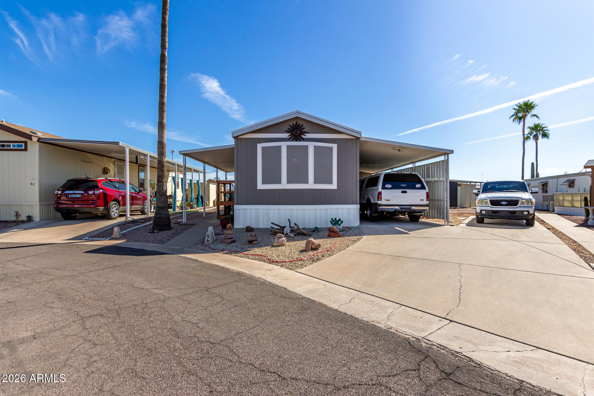 269 North Winchester Road, Unit 66 Apache Junction, AZ 85119 - Photo 2 of 28 a car parked in front of house