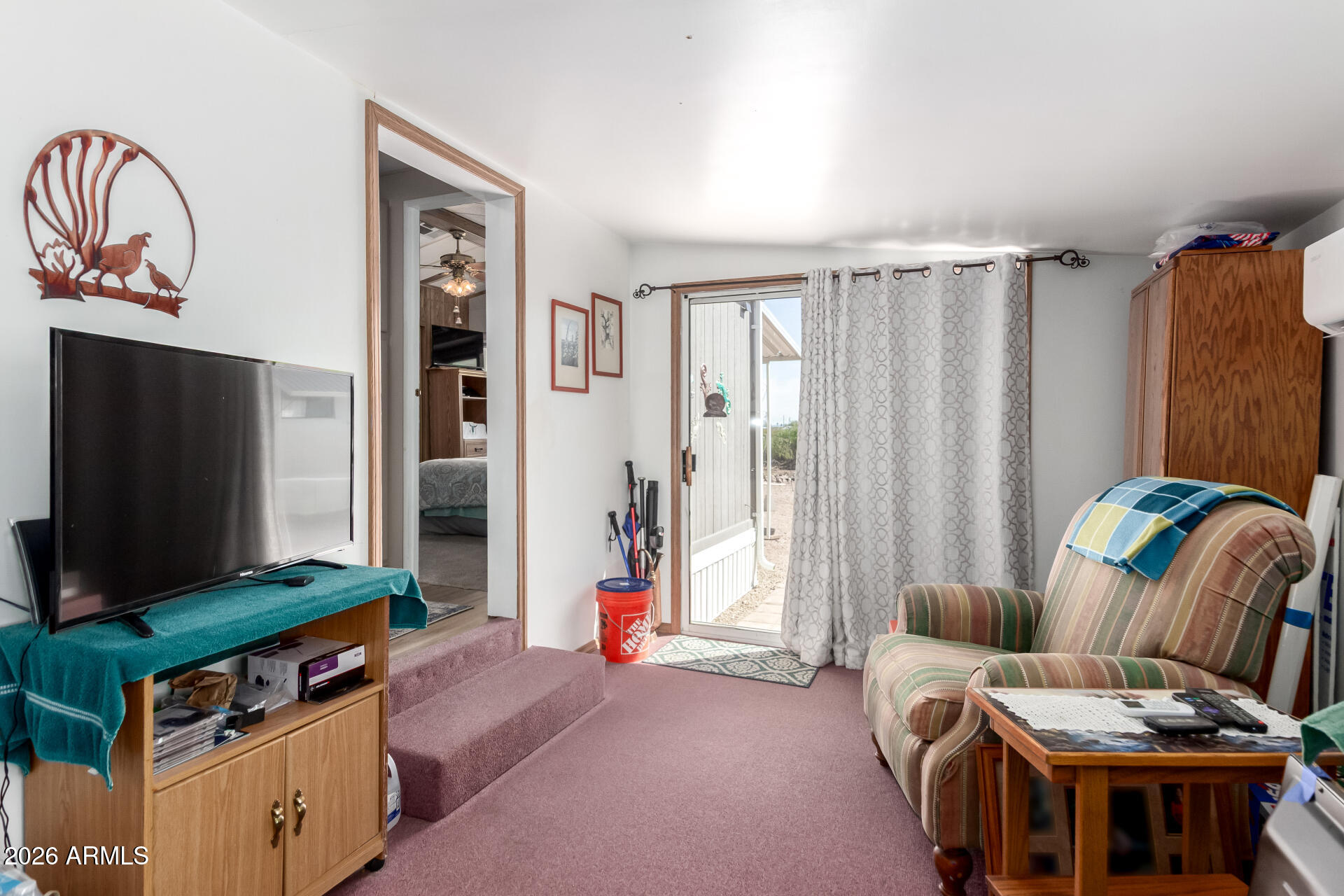 269 North Winchester Road, Unit 66 Apache Junction, AZ 85119 - Photo 22 of 28 a living room with furniture and a flat screen tv