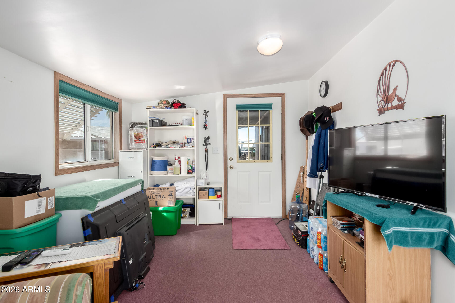 269 North Winchester Road, Unit 66 Apache Junction, AZ 85119 - Photo 23 of 28 a living room with furniture and a flat screen tv
