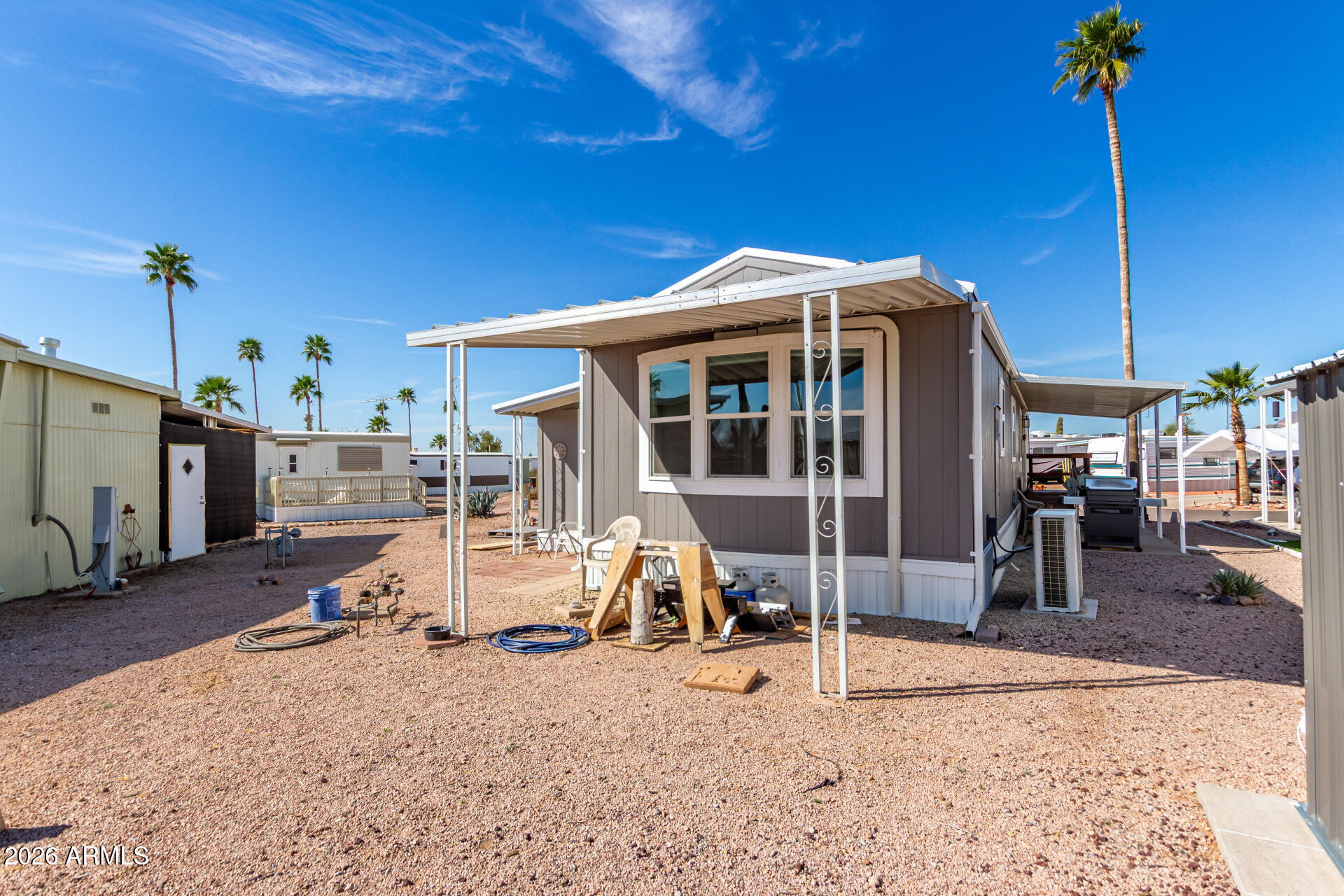 269 North Winchester Road, Unit 66 Apache Junction, AZ 85119 - Photo 28 of 28 a view of a house with a patio