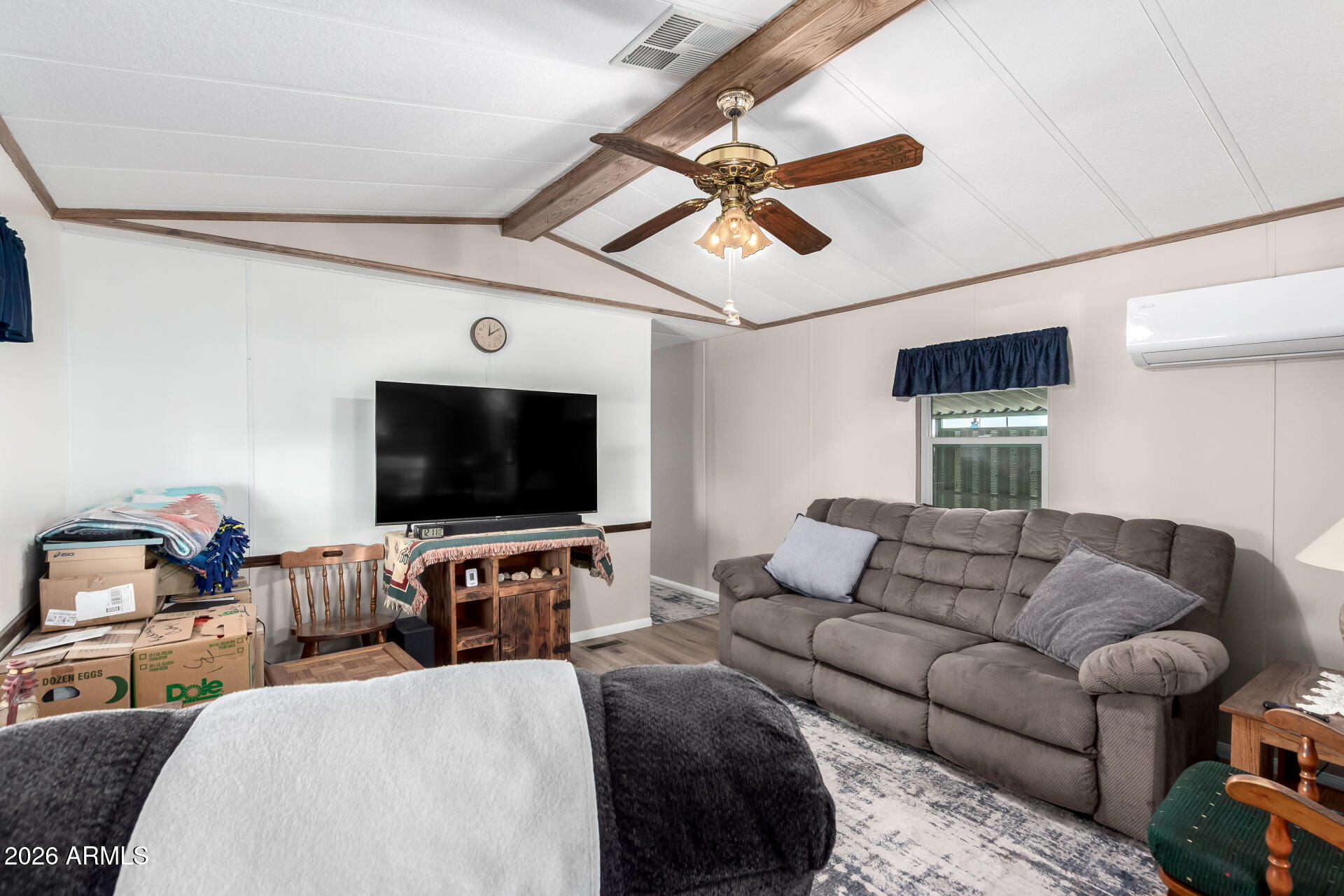 269 North Winchester Road, Unit 66 Apache Junction, AZ 85119 - Photo 4 of 28 a living room with furniture and a flat screen tv